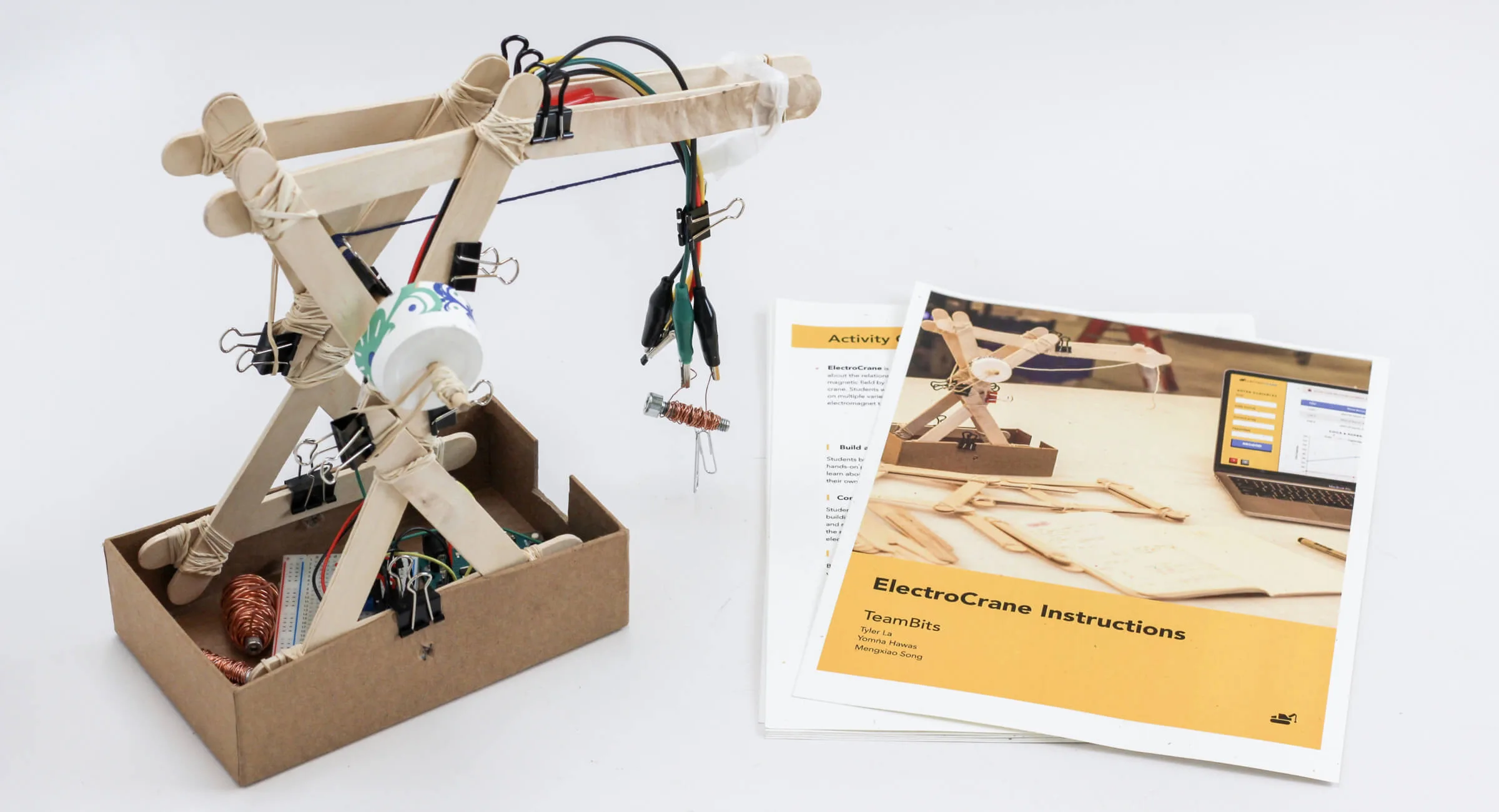Spread of the ElectroCrane lesson plan booklet showing student activity sheets and instructions for the electromagnetic crane experiment