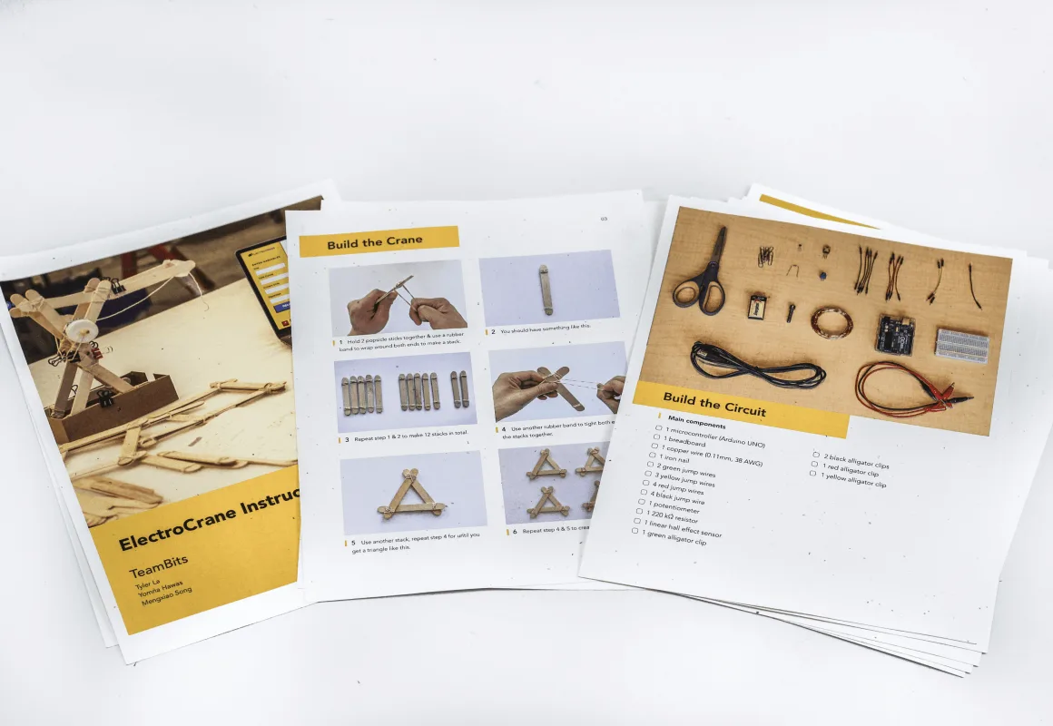 Close-up detail of the ElectroCrane showing the circuit connection between the battery pack and electromagnet coil