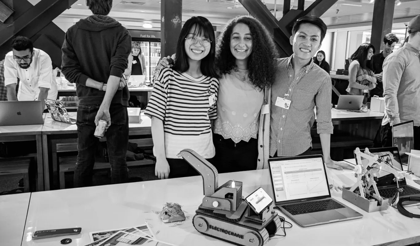 Tyler La and teammates at the Microsoft campus showcase in Redmond, WA, demonstrating ElectroCrane to visitors and Microsoft employees