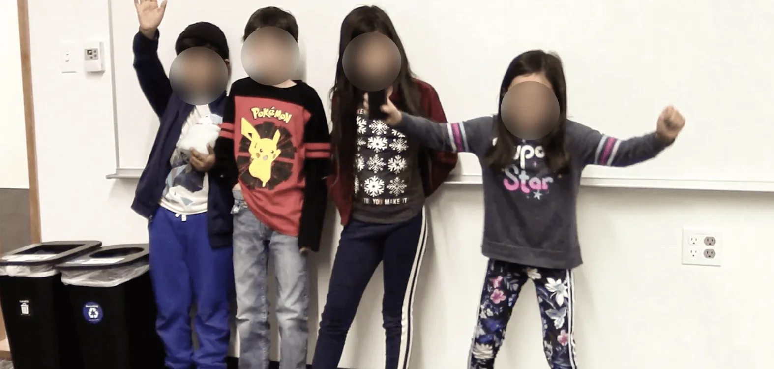 Elementary school students in a classroom participating in a co-design session to brainstorm and evaluate the ElectroCrane concept