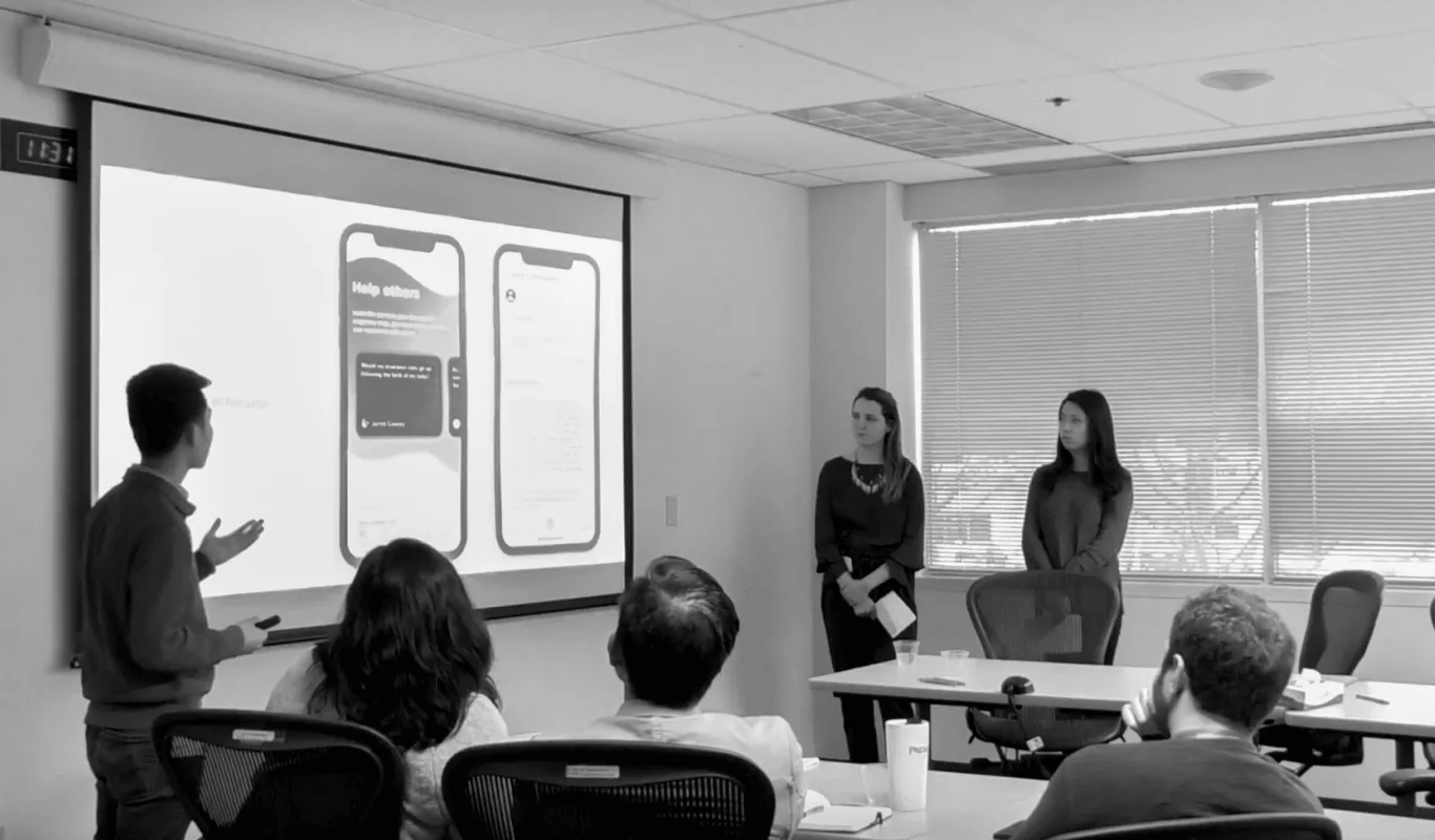 Tyler La and teammates presenting the Juneau app concept to Premera Blue Cross stakeholders at the pitch session